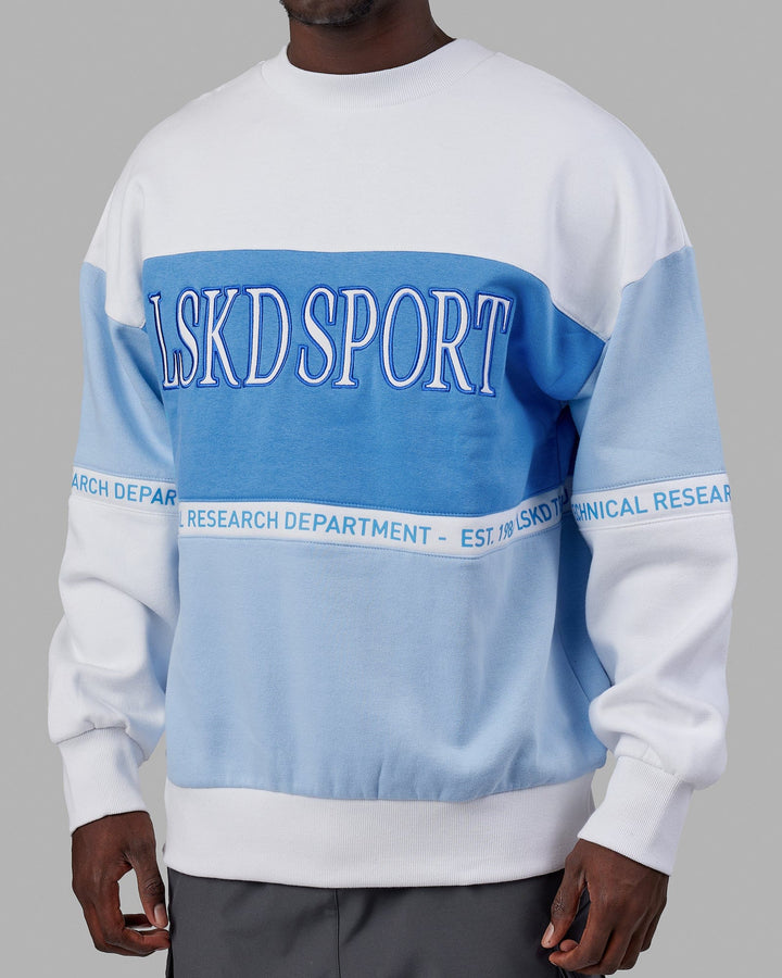 Man wearing Unisex Sportif Sweater Oversize - Windsurfer-Azure Blue