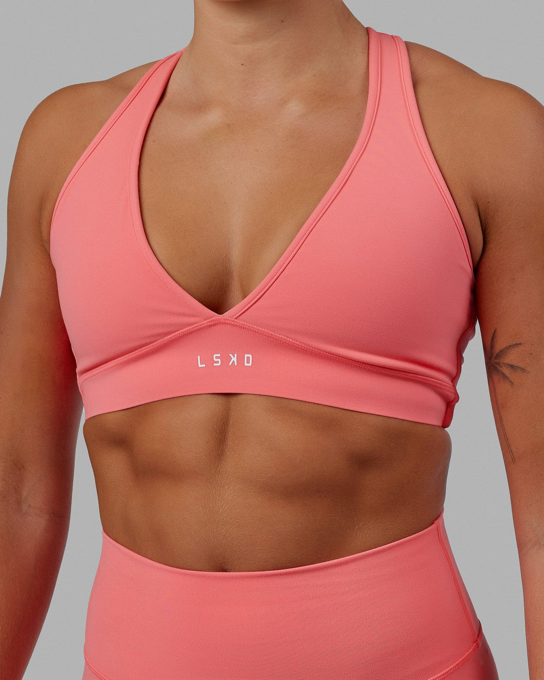 Woman wearing Stamina Bra - Coral