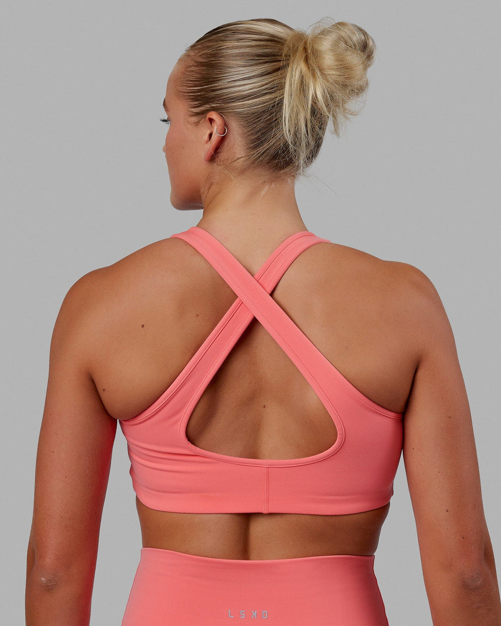 Woman wearing Stamina Bra - Coral