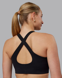Woman wearing Stamina Sports Bra (D/DD/E) - Black | Model:Lillie | Size:S
