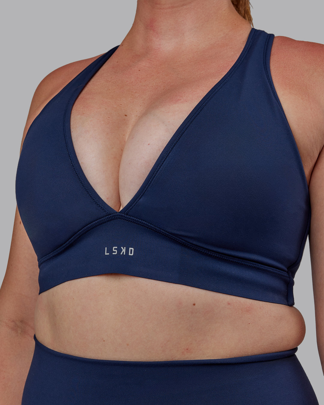 Woman wearing Stamina Sports Bra -(D/DD/E) - Future Navy | Model:Tegan | Size:M