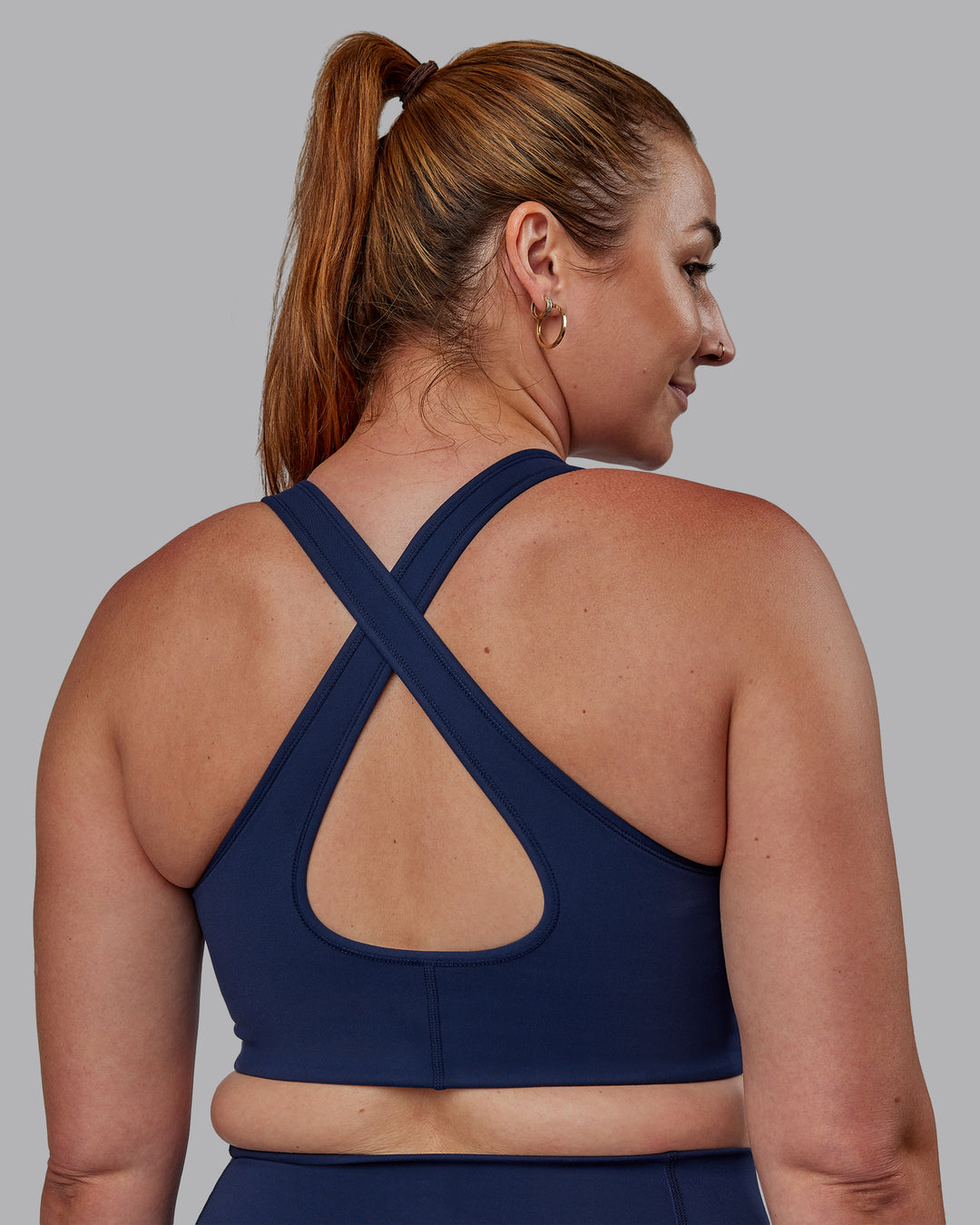 Woman wearing Stamina Sports Bra -(D/DD/E) - Future Navy | Model:Tegan | Size:M