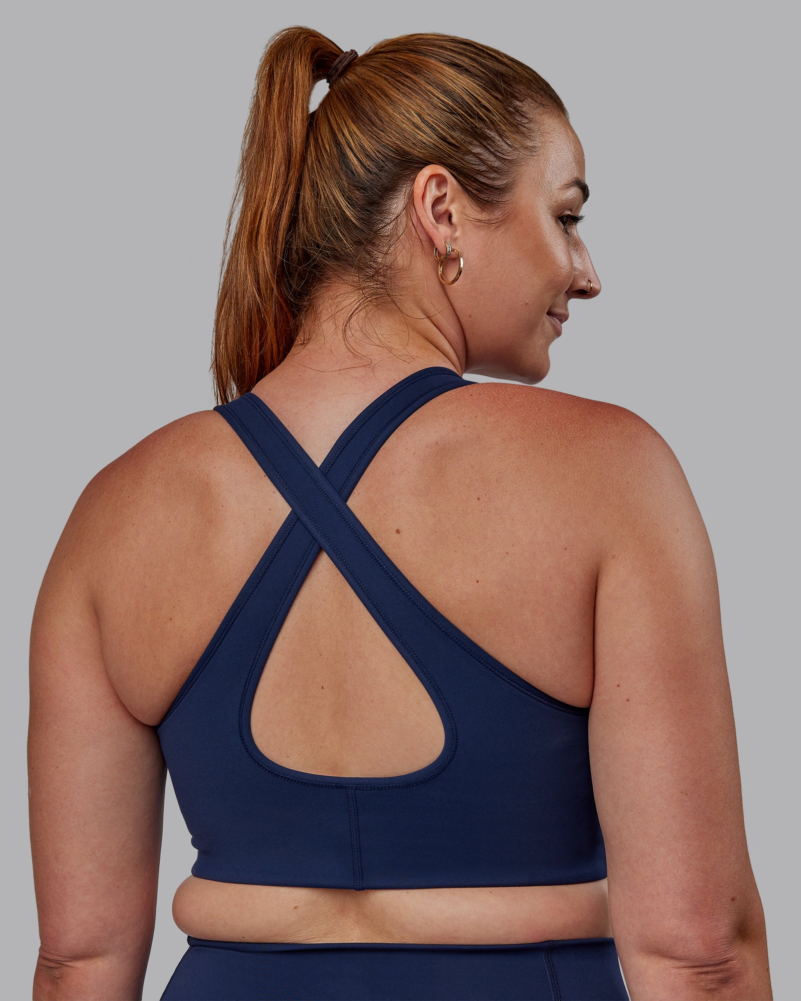 Woman wearing Stamina Sports Bra -(D/DD/E) - Future Navy | Model:Tegan | Size:M