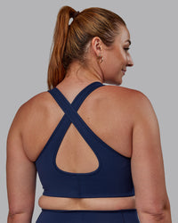 Woman wearing Stamina Sports Bra -(D/DD/E) - Future Navy | Model:Tegan | Size:M
