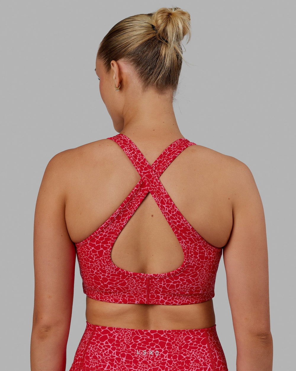 Woman wearing Stamina Sports Bra - Pink Vitality