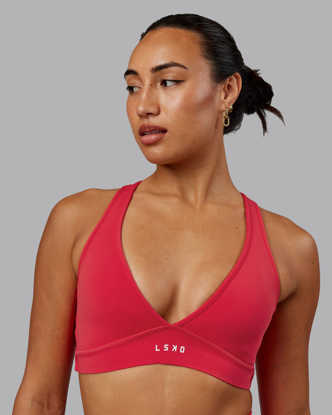 Woman wearing Stamina Sports Bra in Scarlet | Size:S