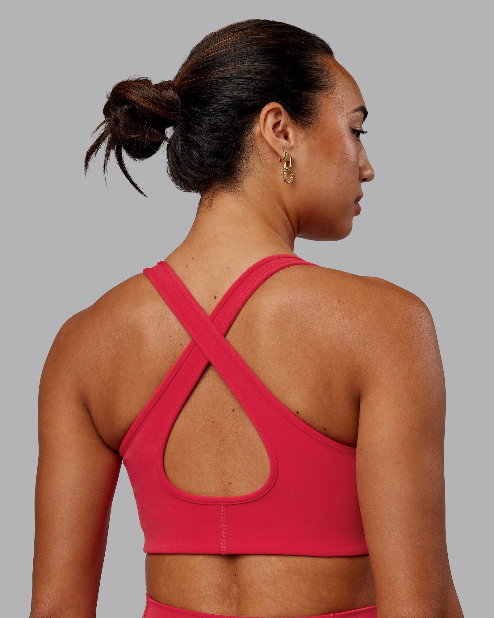 Woman wearing Stamina Sports Bra in Scarlet | Size:S