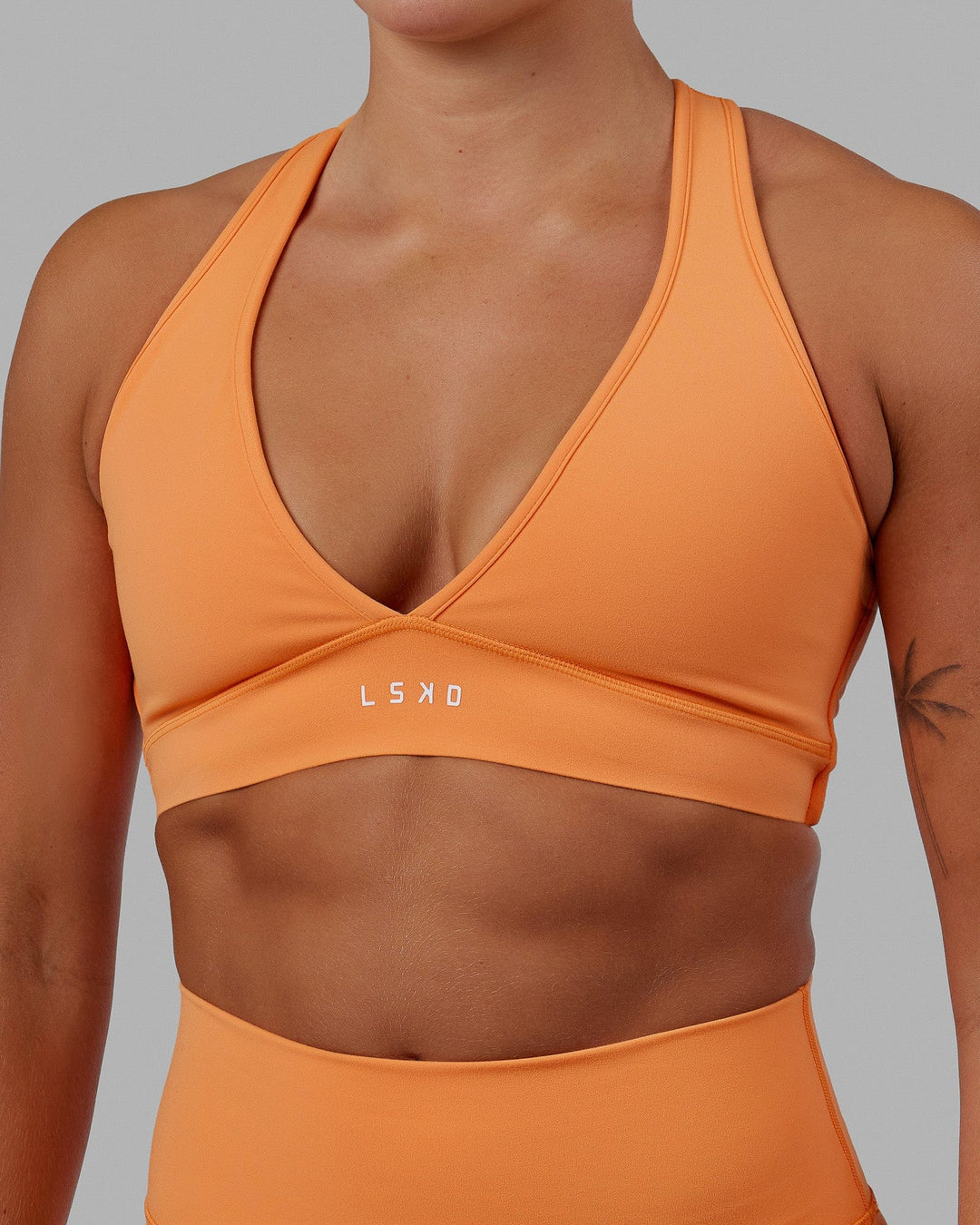 Woman wearing Stamina Bra - Tangerine