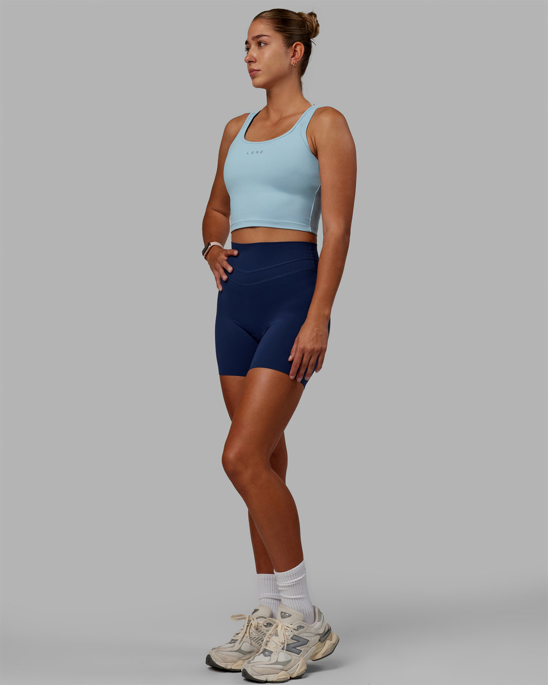 Woman wearing Staple Active Cropped Tank - Glacial Blue