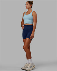 Woman wearing Staple Active Cropped Tank - Glacial Blue