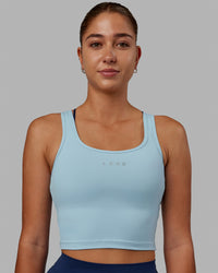 Woman wearing Staple Active Cropped Tank - Glacial Blue