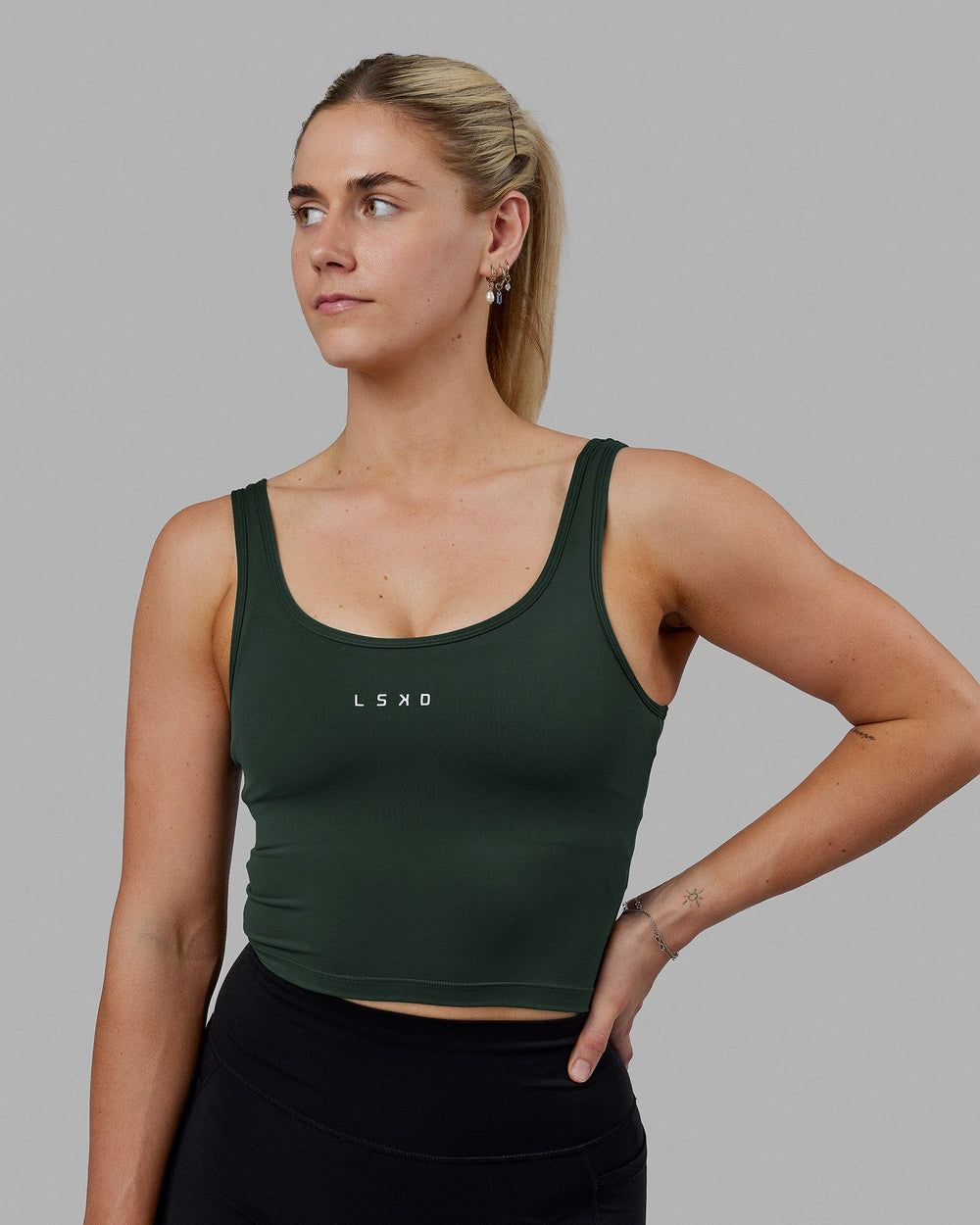 Woman wearing Staple Active Cropped Tank - Vital Green