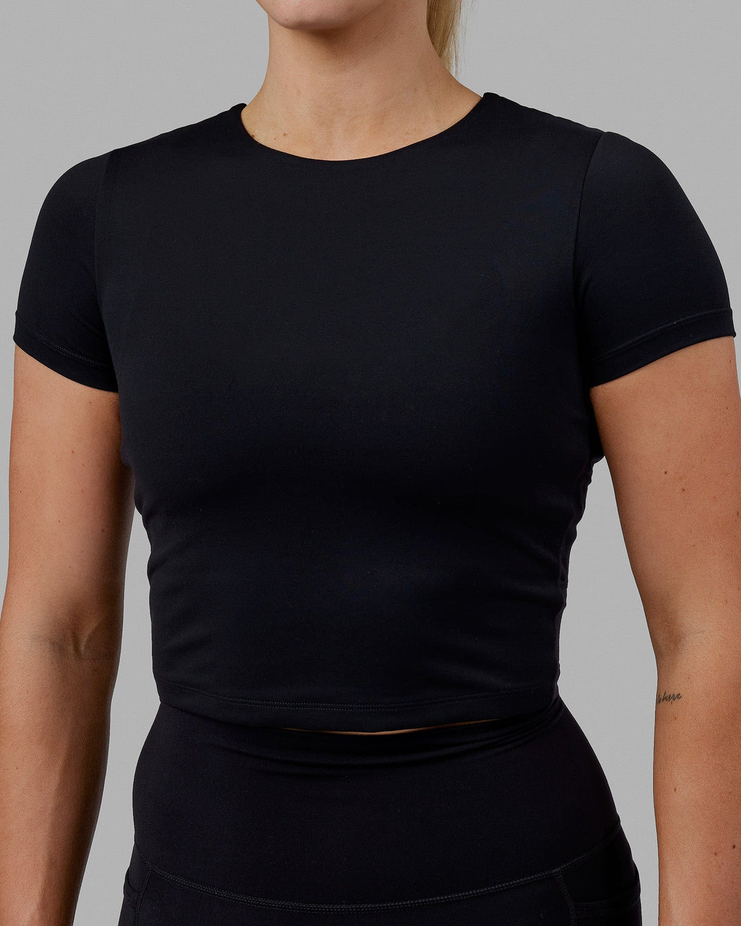 Woman wearing Staple Cropped Tee - Black