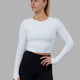 Woman wearing Staple LS Cropped Tee - White