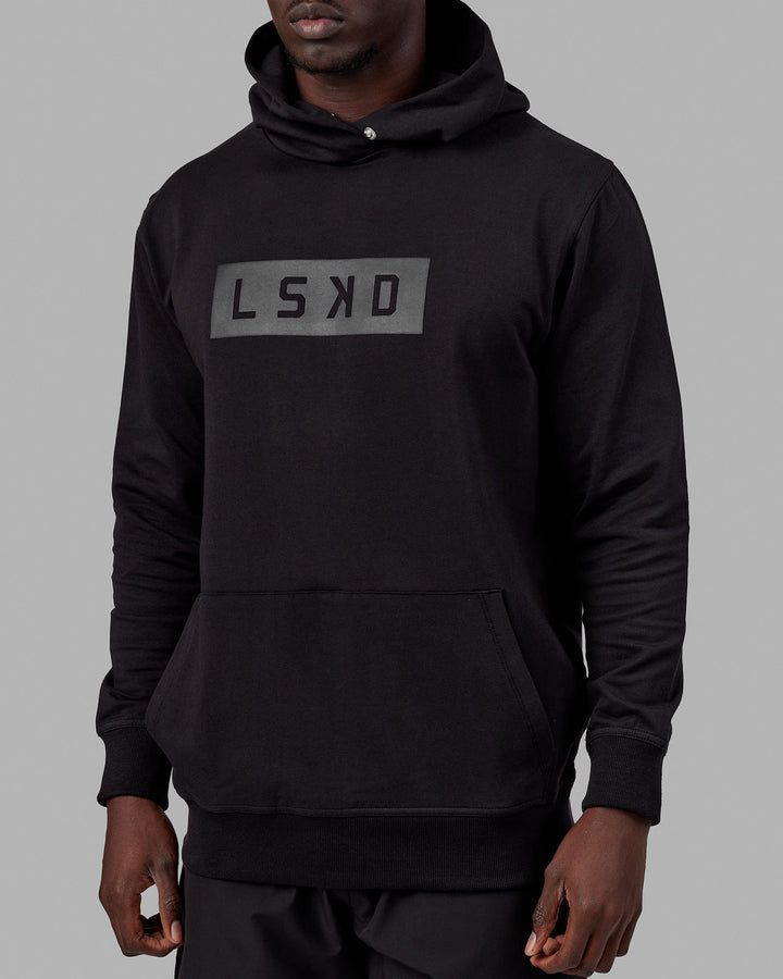 Man wearing Unisex Strength FLXFLeece Hoodie - Black-Black