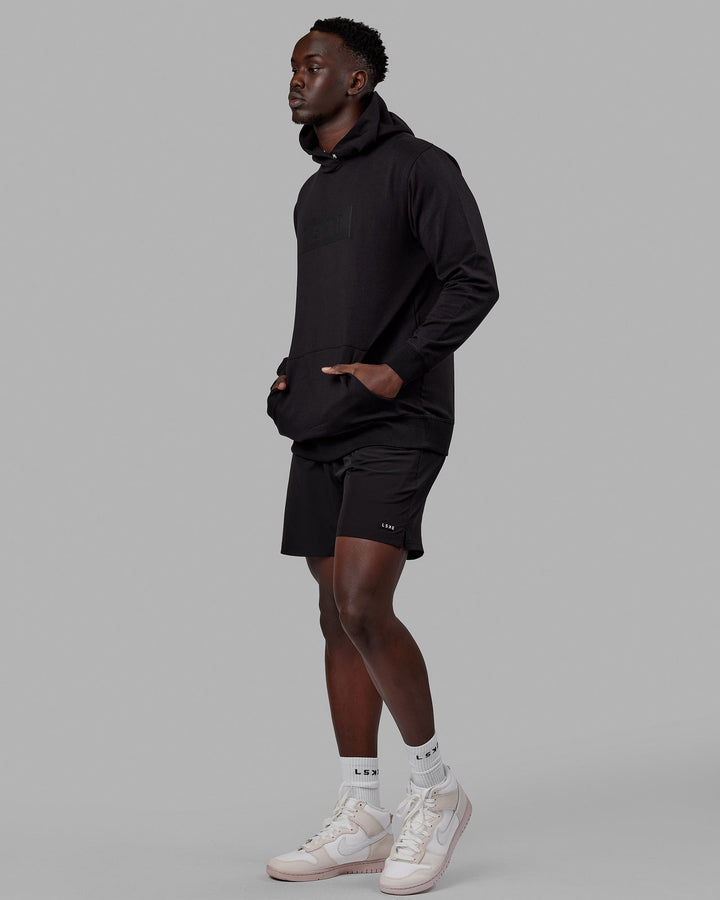 Man wearing Unisex Strength FLXFLeece Hoodie - Black-Black