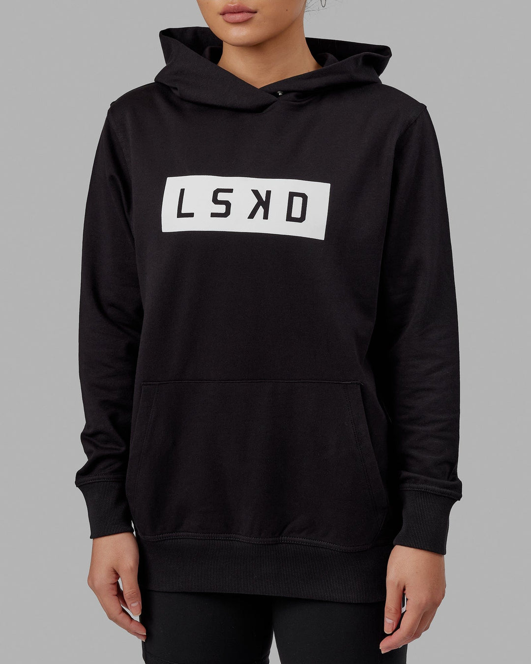 Woman wearing Unisex Strength FLXFLeece Hoodie - Black-White