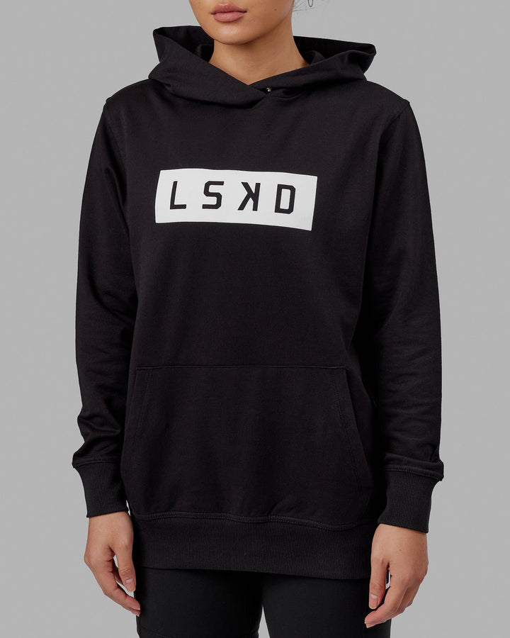 Woman wearing Unisex Strength FLXFLeece Hoodie - Black-White