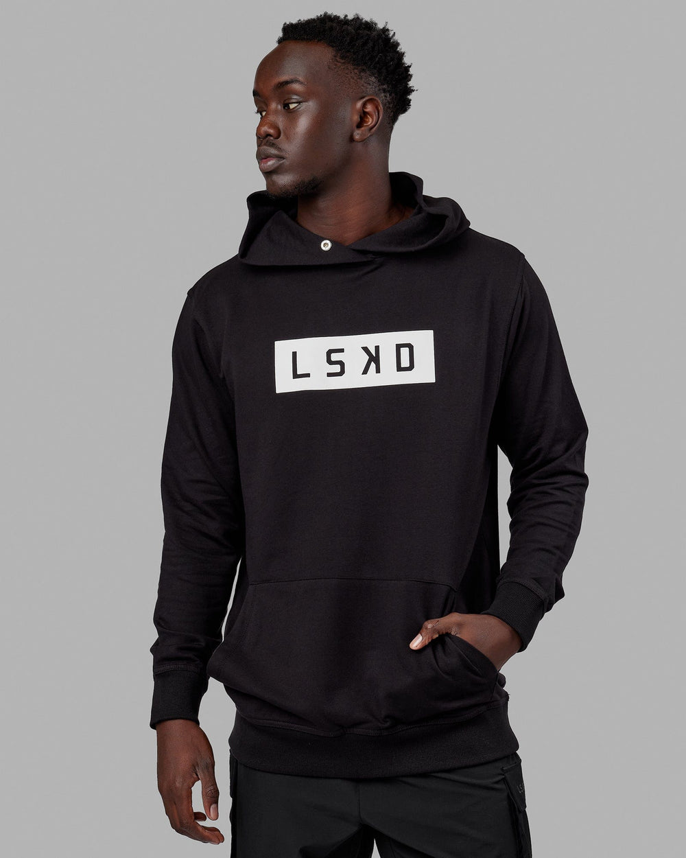 Man wearing Unisex Strength FLXFLeece Hoodie - Black-White