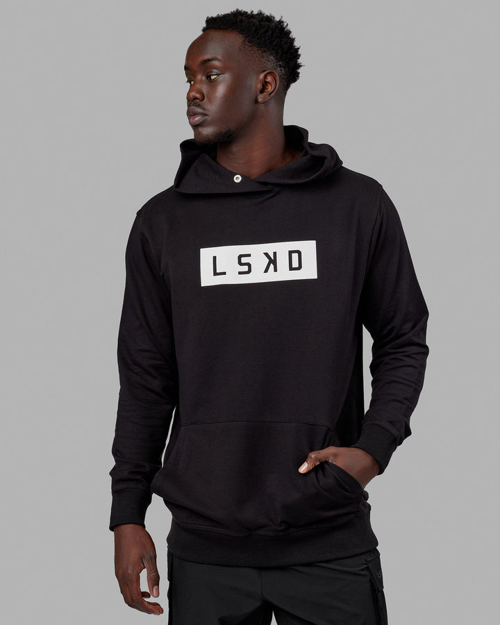 Man wearing Unisex Strength FLXFLeece Hoodie - Black-White