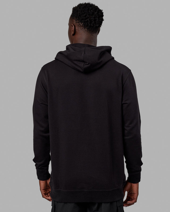 Man wearing Unisex Strength FLXFLeece Hoodie - Black-White