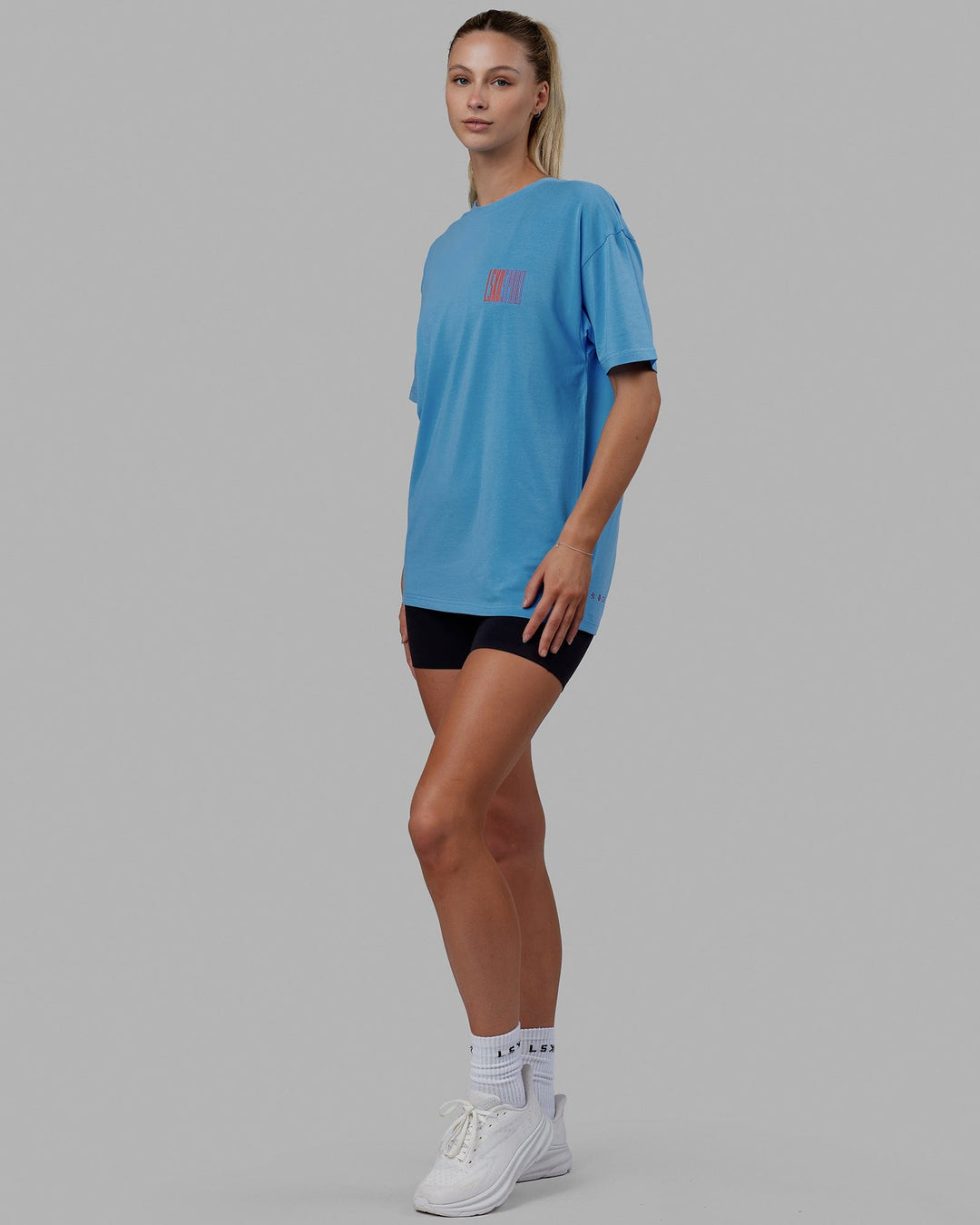 Woman wearing Unisex Stretch It FLXCotton Tee Oversize - Azure Blue
