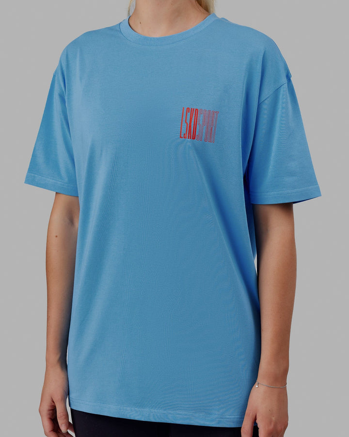 Woman wearing Unisex Stretch It FLXCotton Tee Oversize - Azure Blue