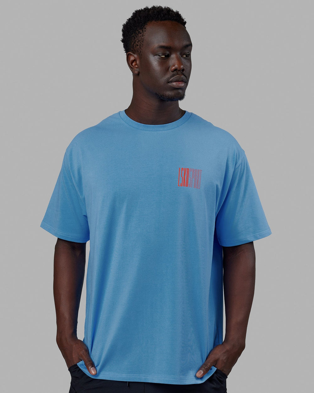 Man wearing Unisex Stretch It FLXCotton Tee Oversize - Azure Blue