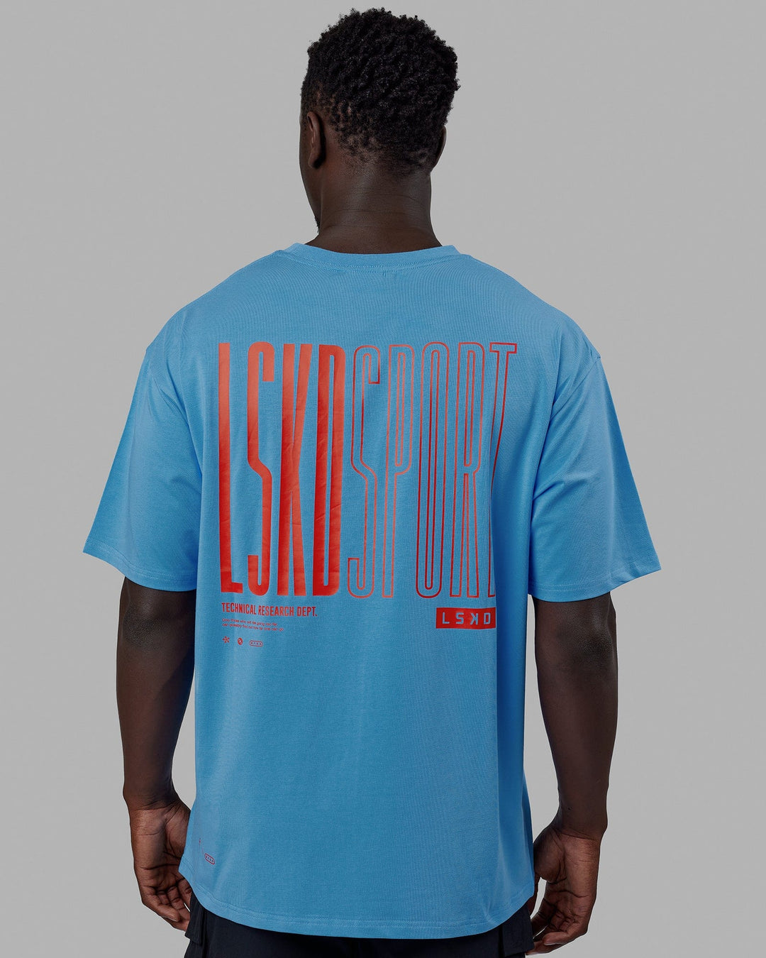 Man wearing Unisex Stretch It FLXCotton Tee Oversize - Azure Blue