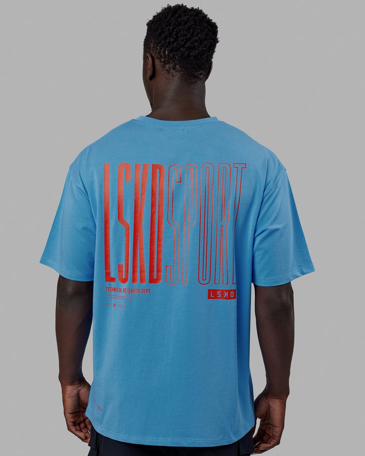 Man wearing Unisex Stretch It FLXCotton Tee Oversize - Azure Blue