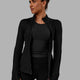 Woman wearing Stride Zip Through Thermal Jacket - Black