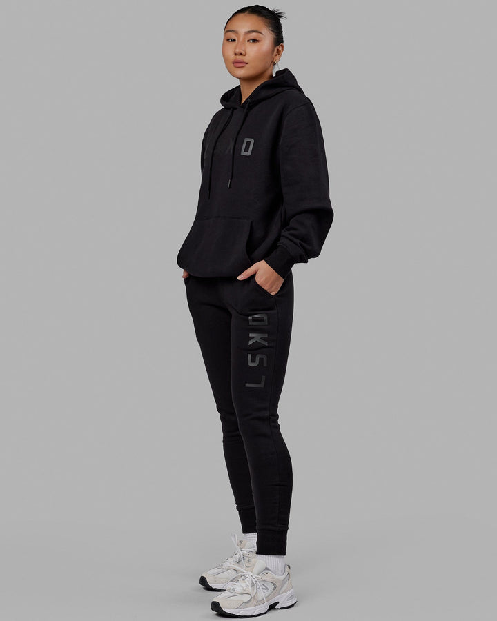 Woman wearing Unisex Structure Hoodie - Black-Black