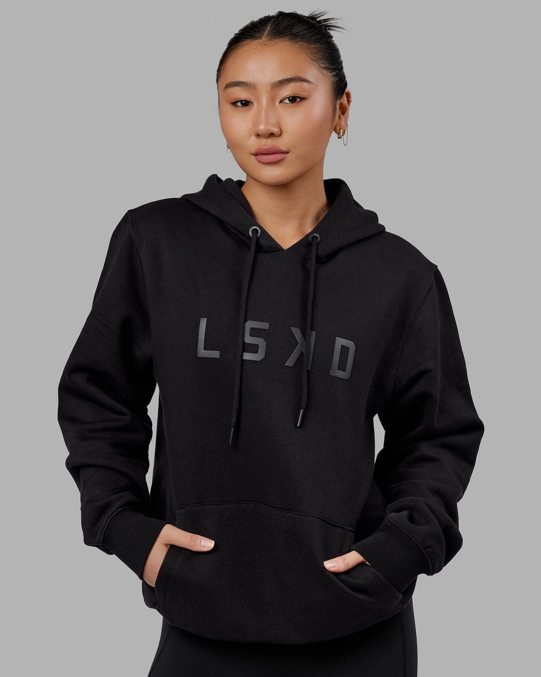 Woman wearing Unisex Structure Hoodie - Black-Black