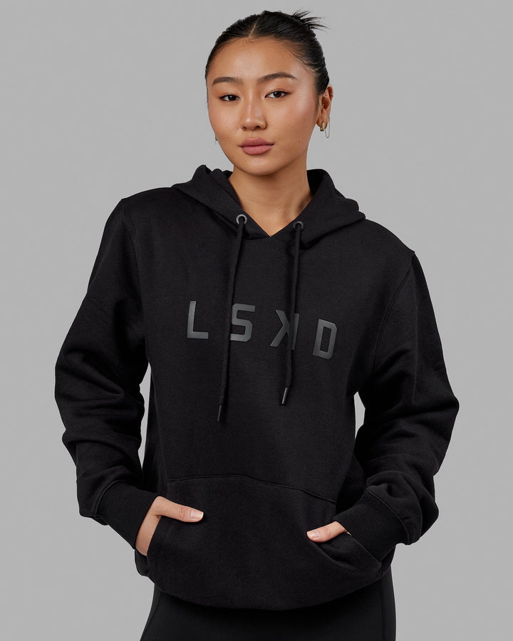 Woman wearing Unisex Structure Hoodie - Black-Black