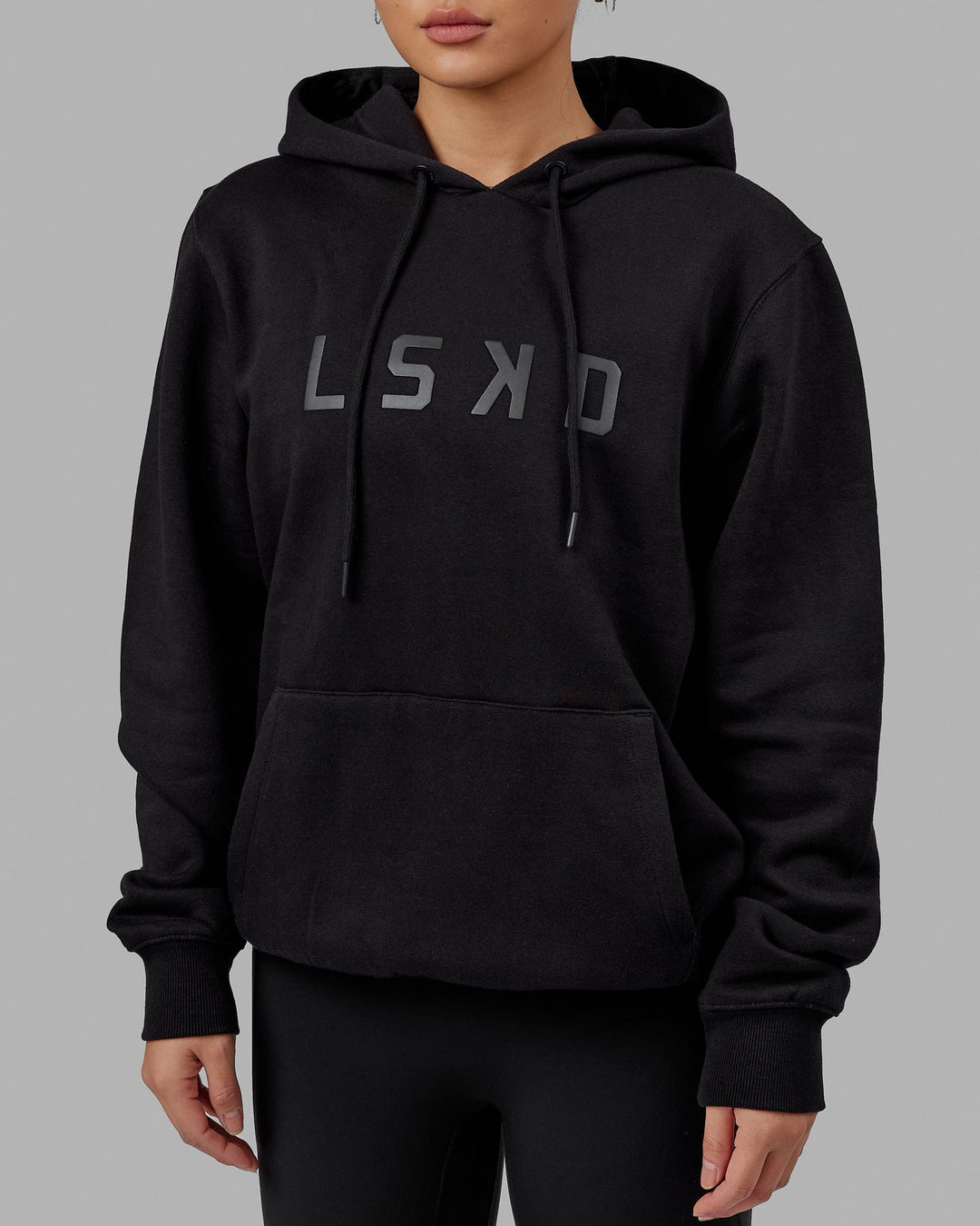 Woman wearing Unisex Structure Hoodie - Black-Black