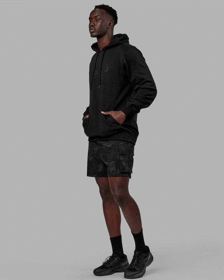 Man wearing Unisex Structure Hoodie - Black-Black