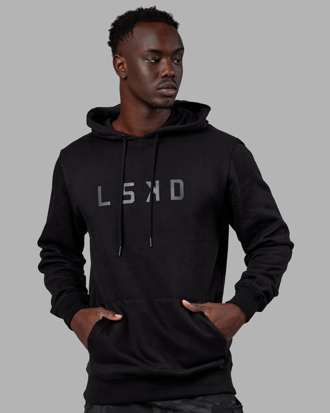Man wearing Unisex Structure Hoodie - Black-Black