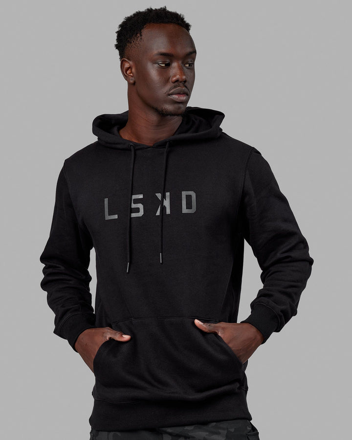 Man wearing Unisex Structure Hoodie - Black-Black