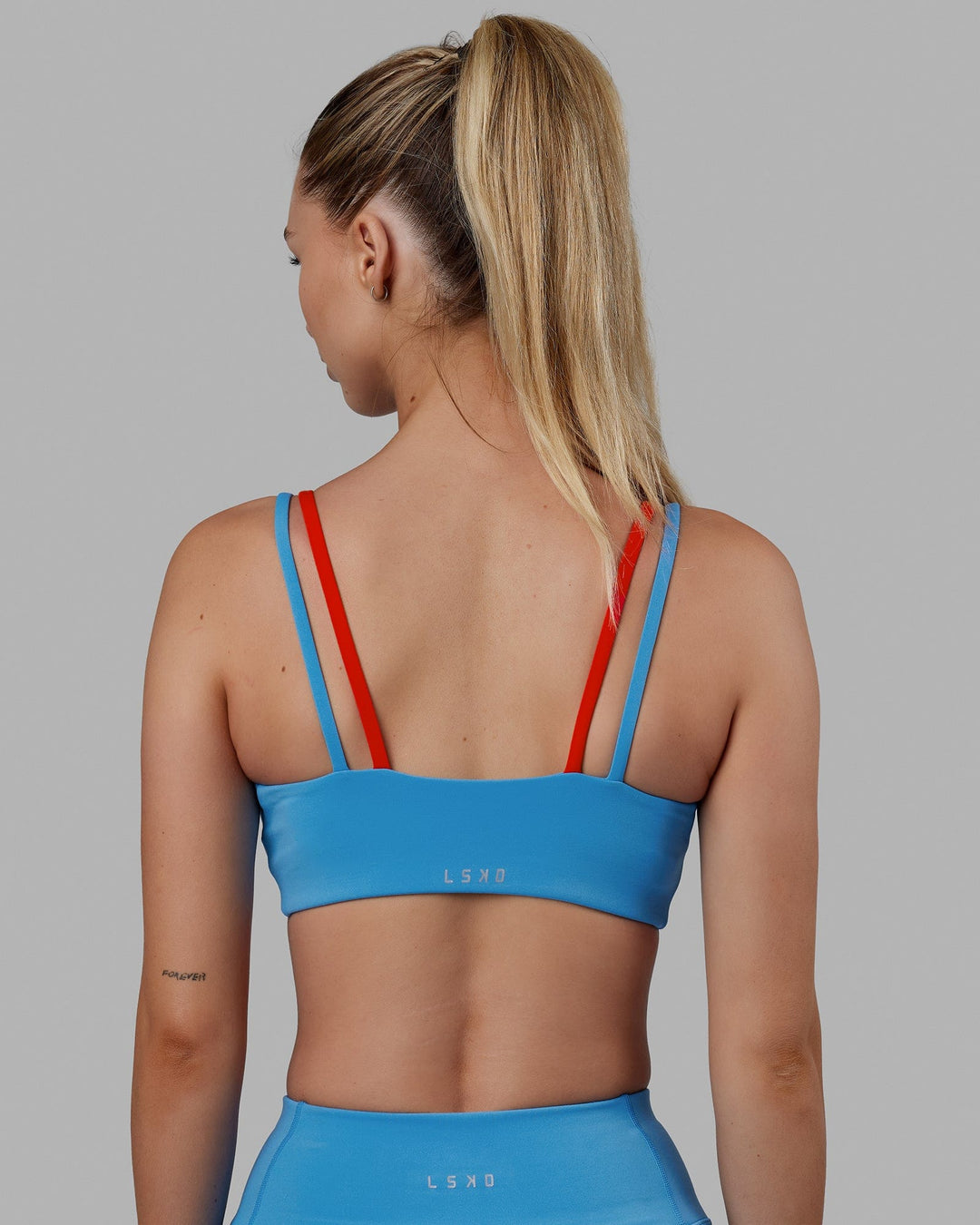 Woman wearing Structure Sports Bra - Azure Blue-Infrared