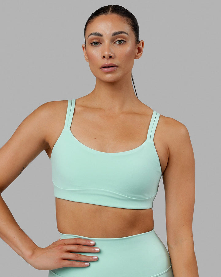 Woman wearing Structure Sports Bra - Pastel Turquoise
