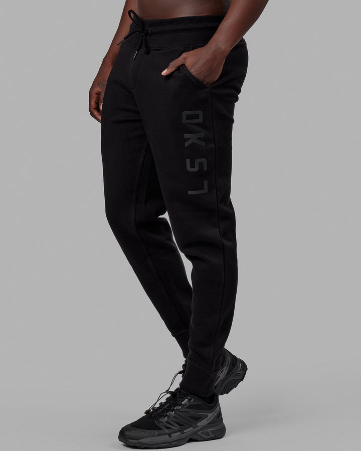Man wearing Unisex Structure Track Pant - Black-Black