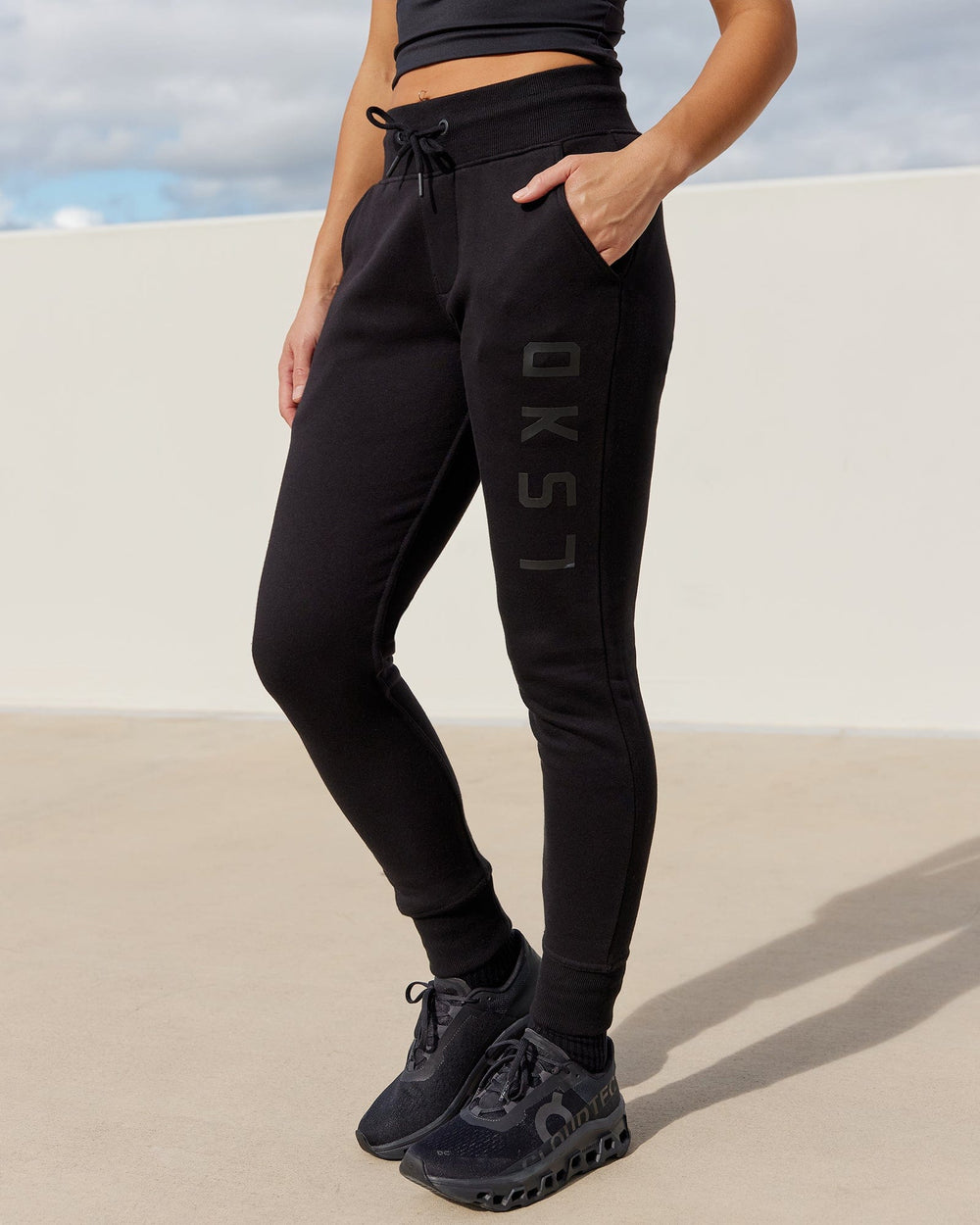 Woman wearing Unisex Structure Track Pant - Black-Black