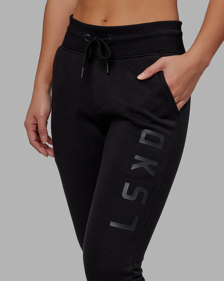 Woman wearing Unisex Structure Track Pant - Black-Black