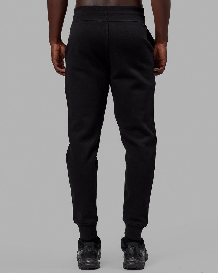 Man wearing Unisex Structure Track Pant - Black-White