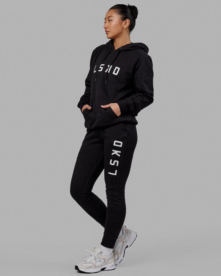 Woman wearing Unisex Structure Track Pant - Black-White