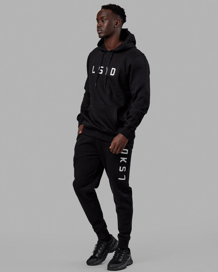 Man wearing Unisex Structure Track Pant - Black-White