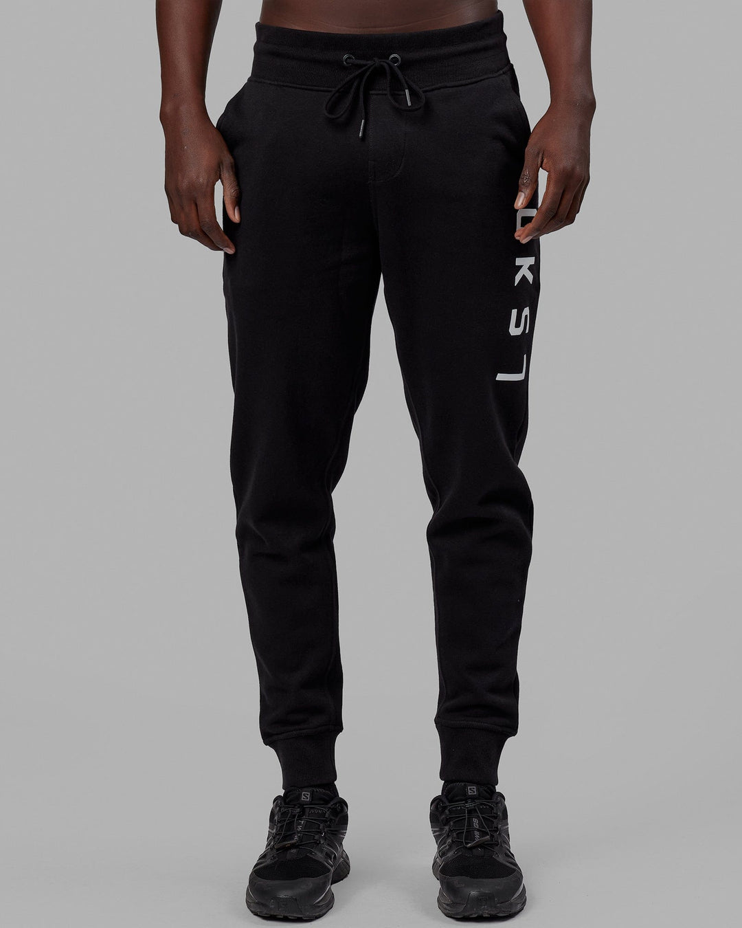 Man wearing Unisex Structure Track Pant - Black-White