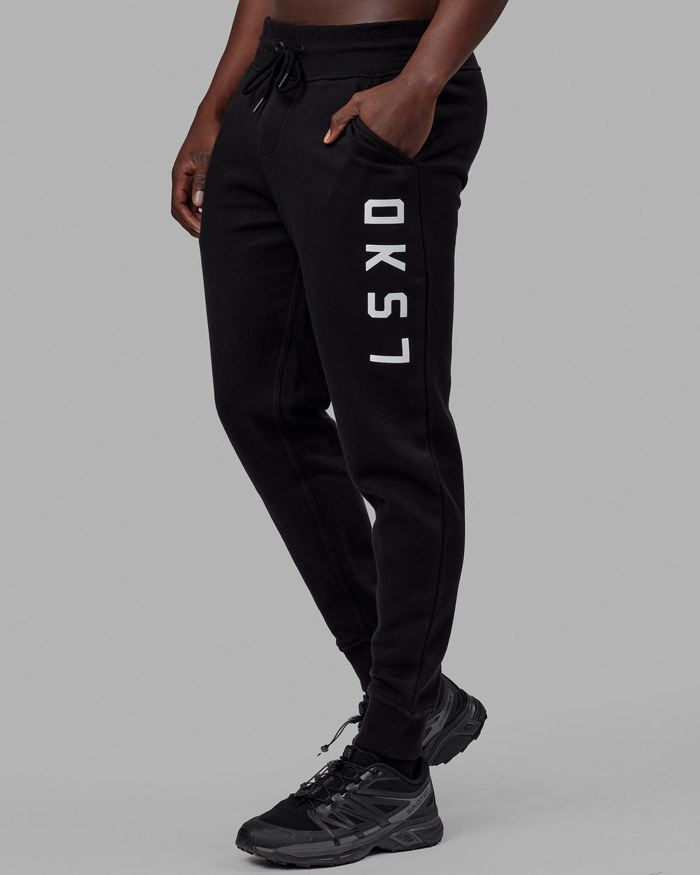 Man wearing Unisex Structure Track Pant - Black-White