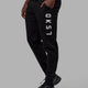 Man wearing Unisex Structure Track Pant - Black-White