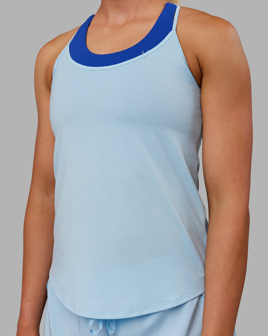 Woman wearing Swift Active Tank - Glacial Blue